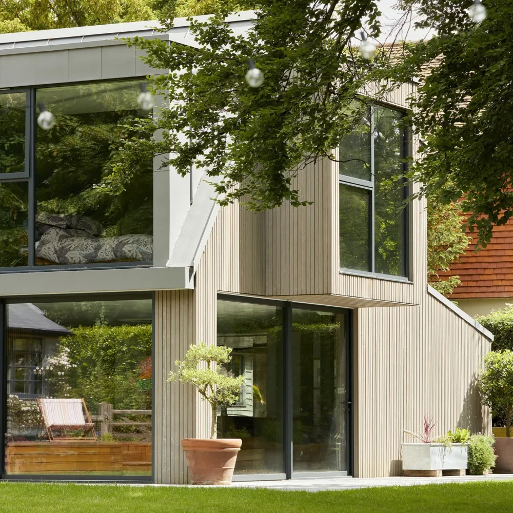 Dust_Apple_Tree_19-copy a house with glass windows and grass