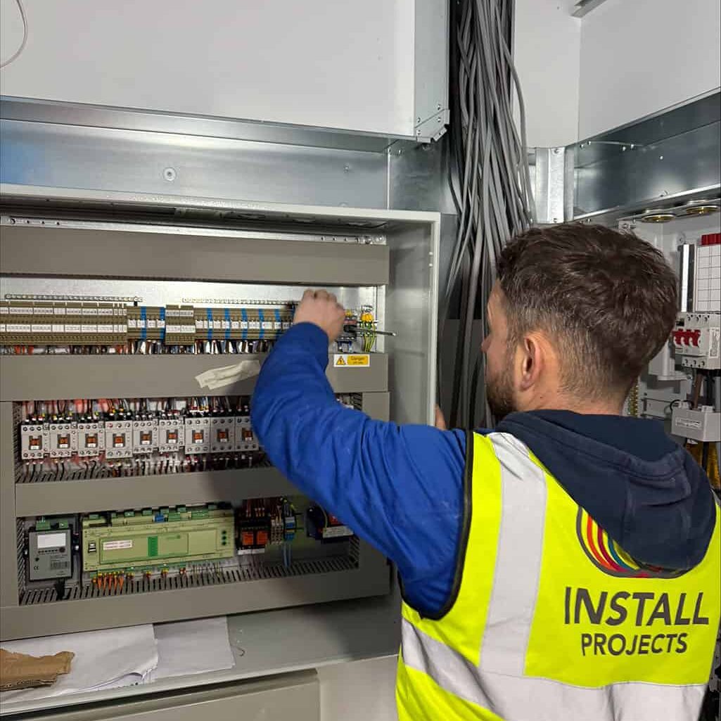 engineer working on breaker panel